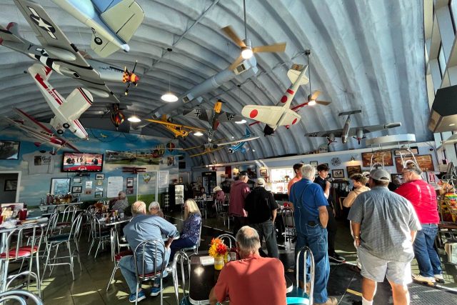 interior of Hangar Kafe with model airplanes hanging from the wall