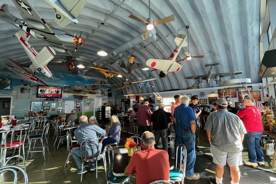 interior of Hangar Kafe with model airplanes hanging from the wall